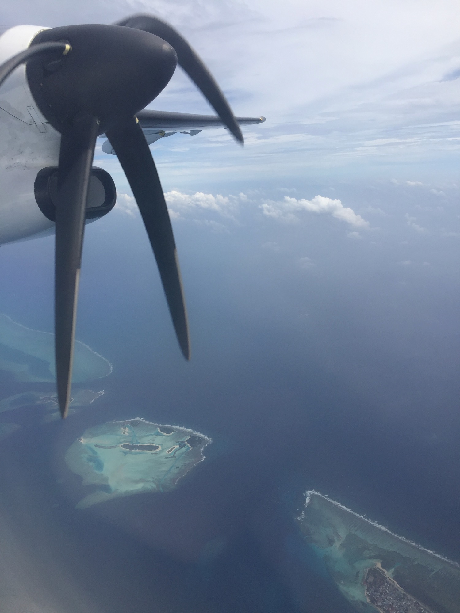 an airplane propeller above the ocean