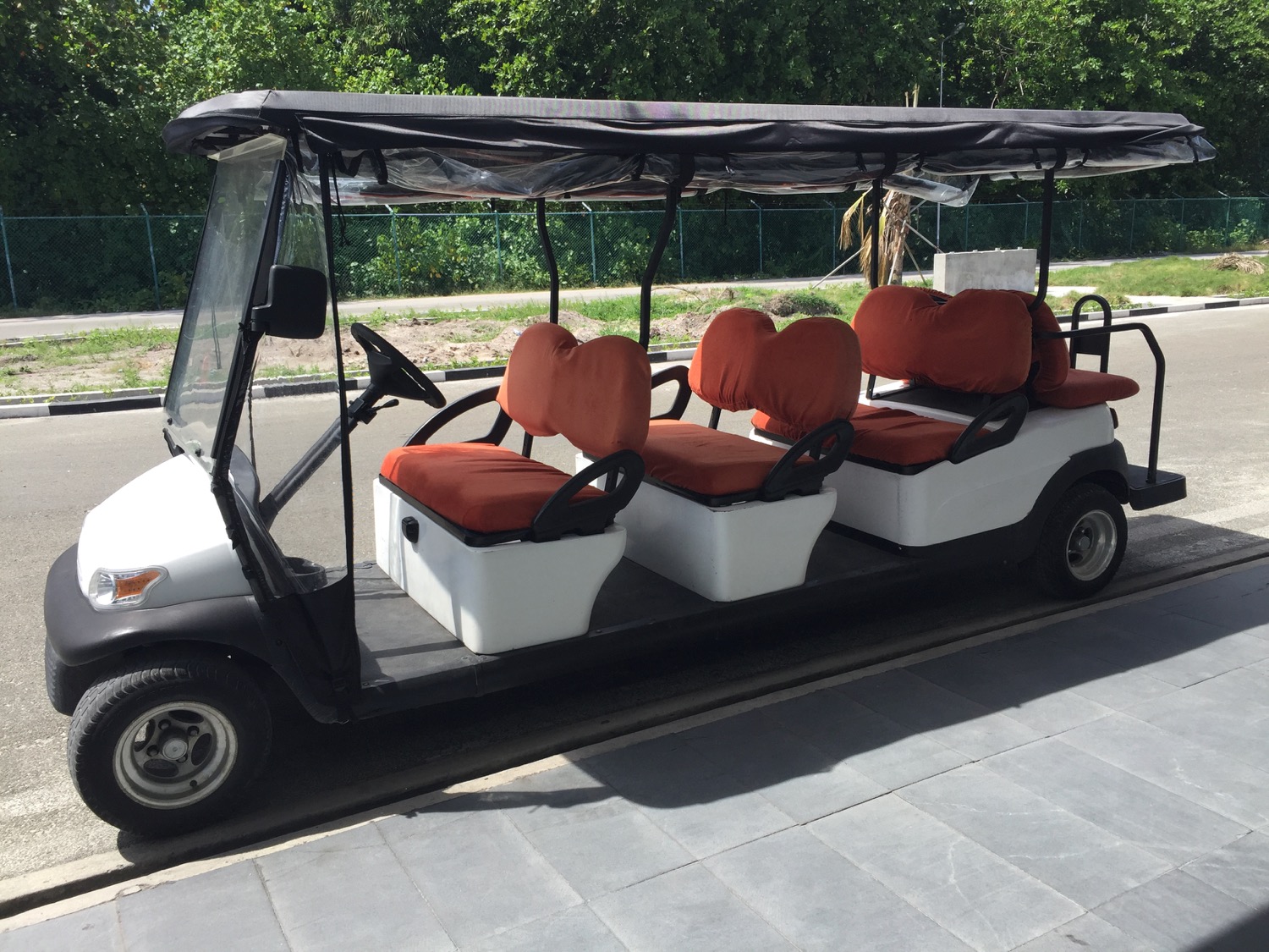 a golf cart with seats