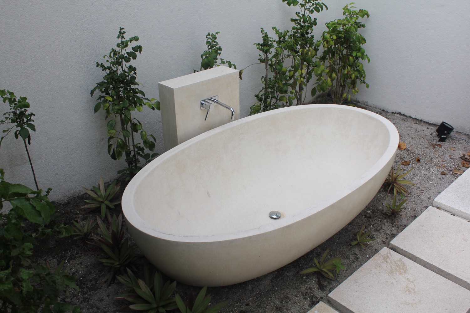 a bathtub in a garden