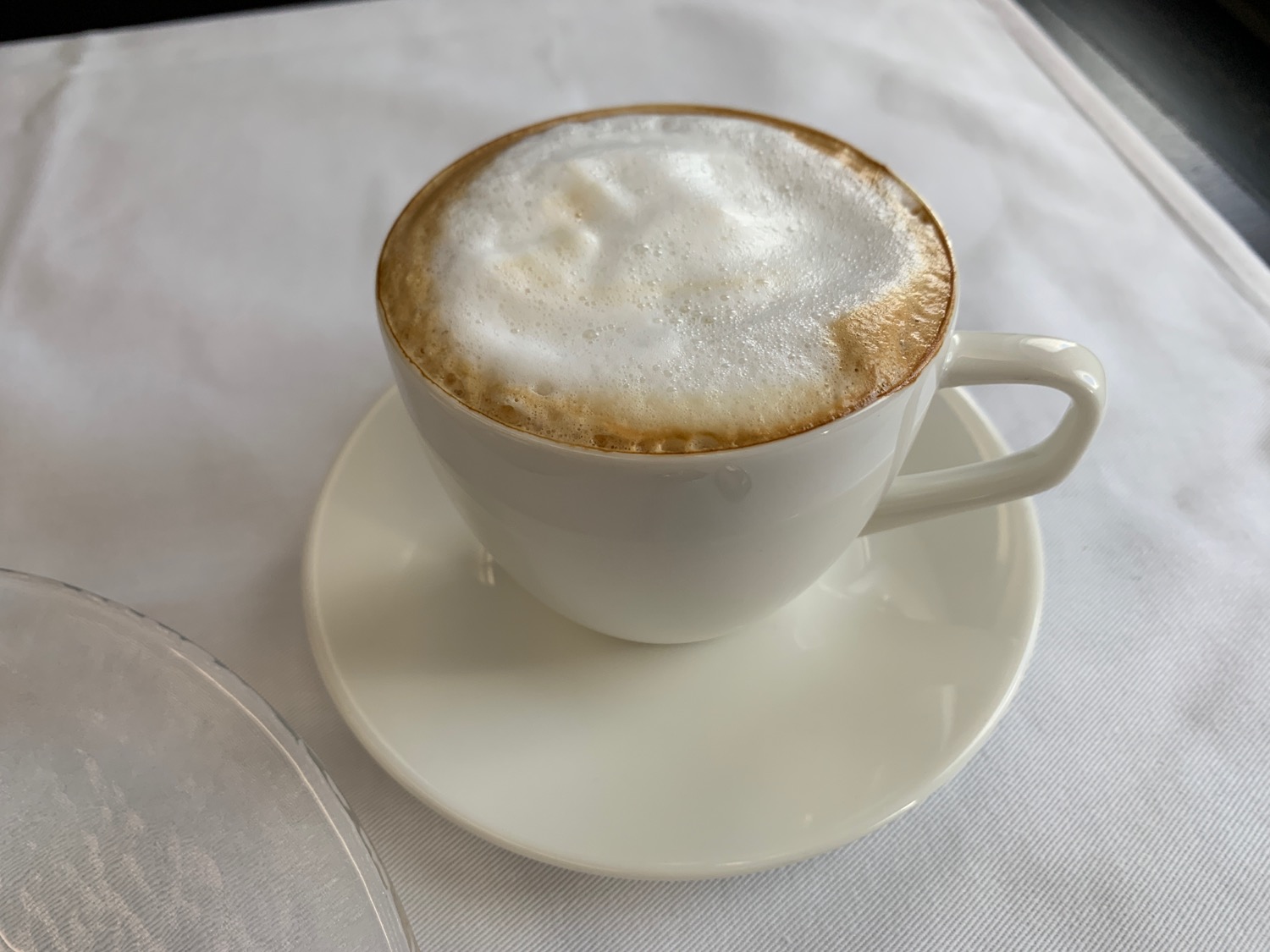 a cup of coffee with foam in it