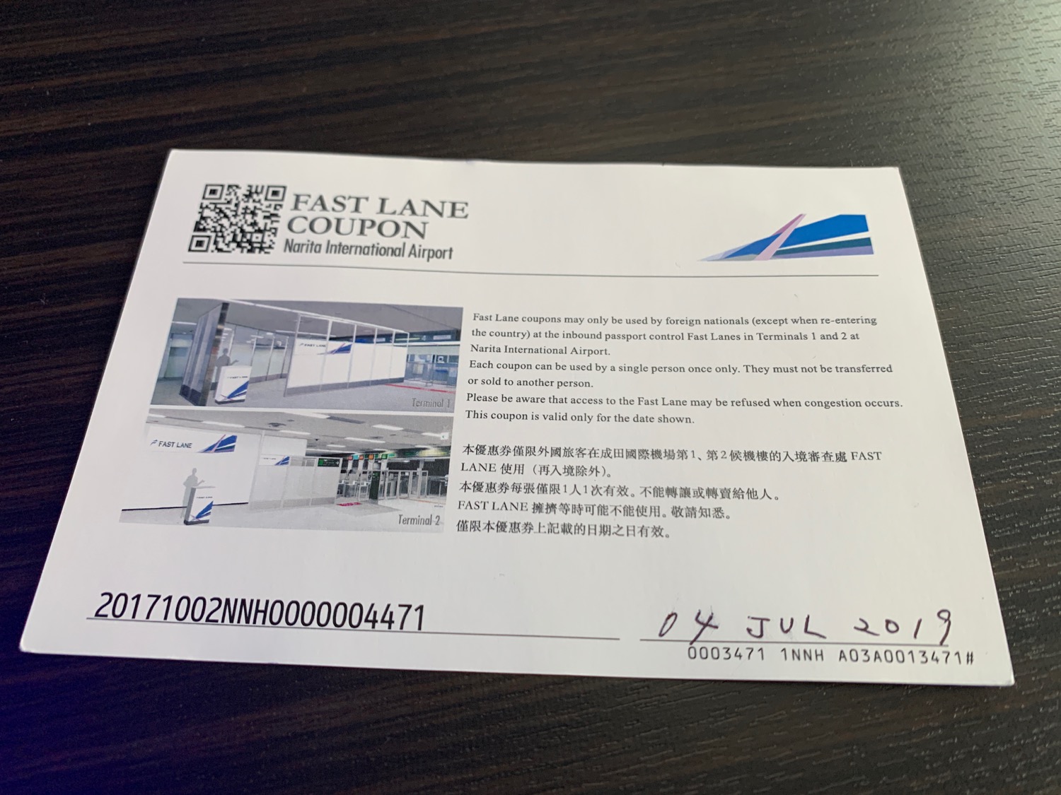 a piece of paper with a picture of a building and a qr code on it