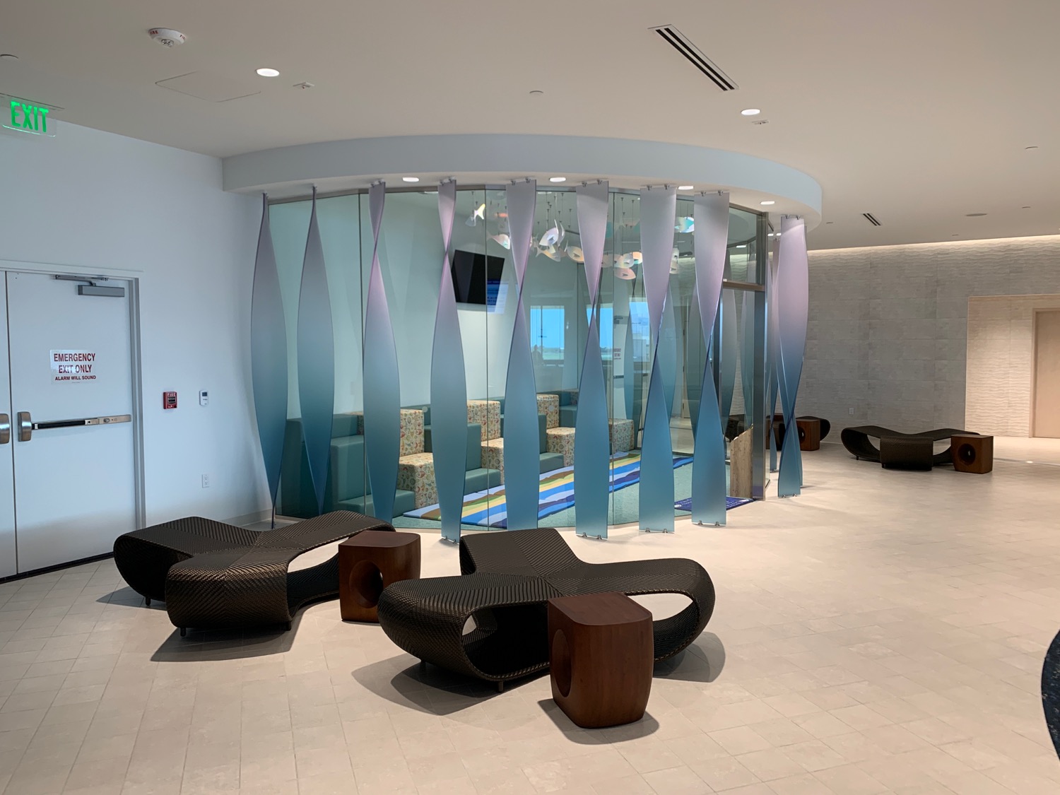 a room with glass walls and chairs