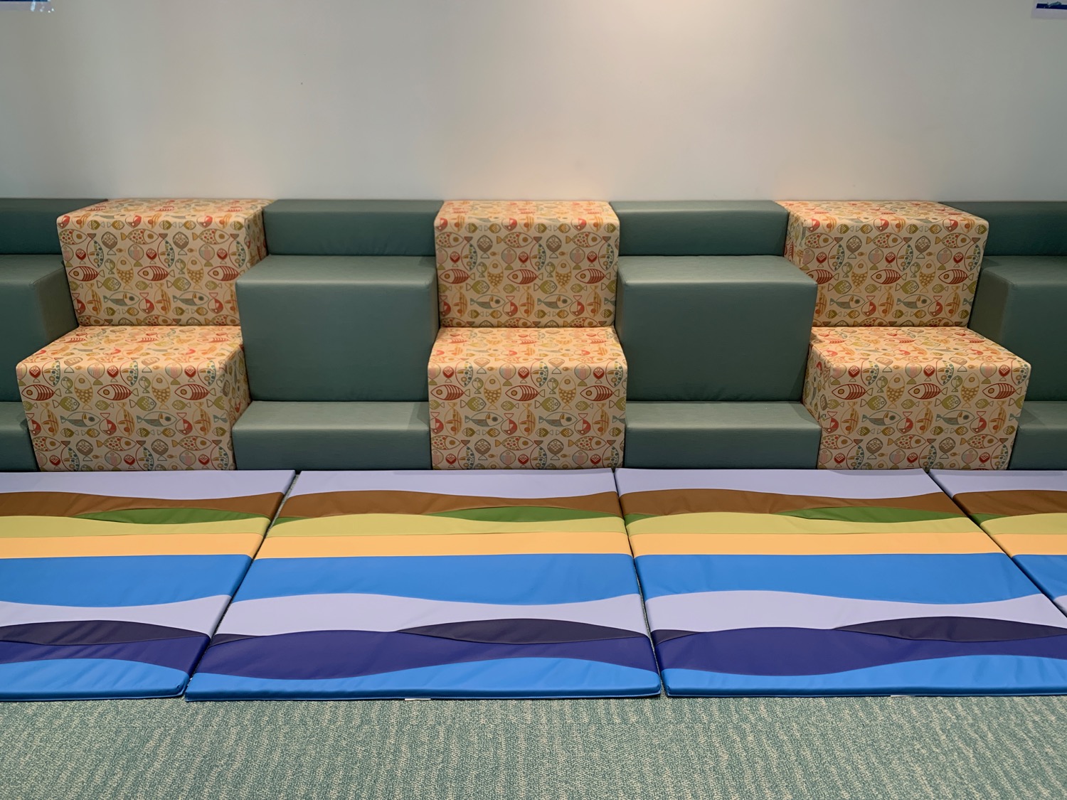 a group of colorful mats on a carpet