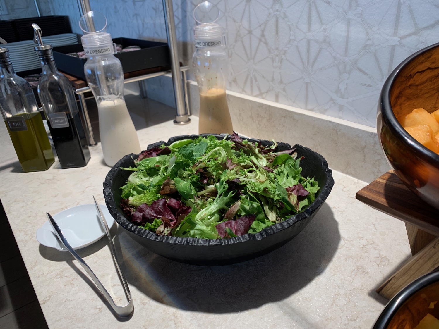 a bowl of salad on a counter