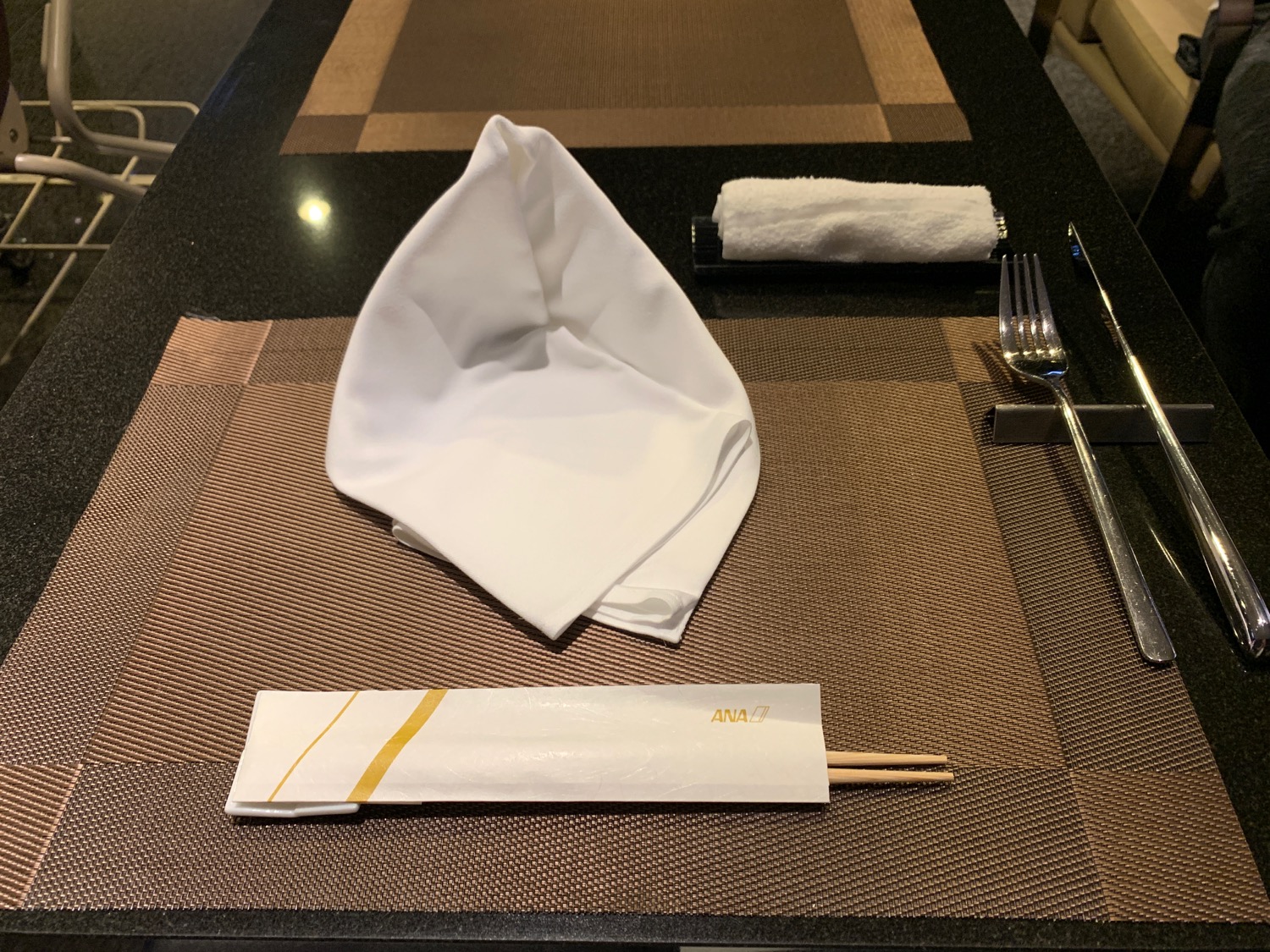 a napkin and chopsticks on a table