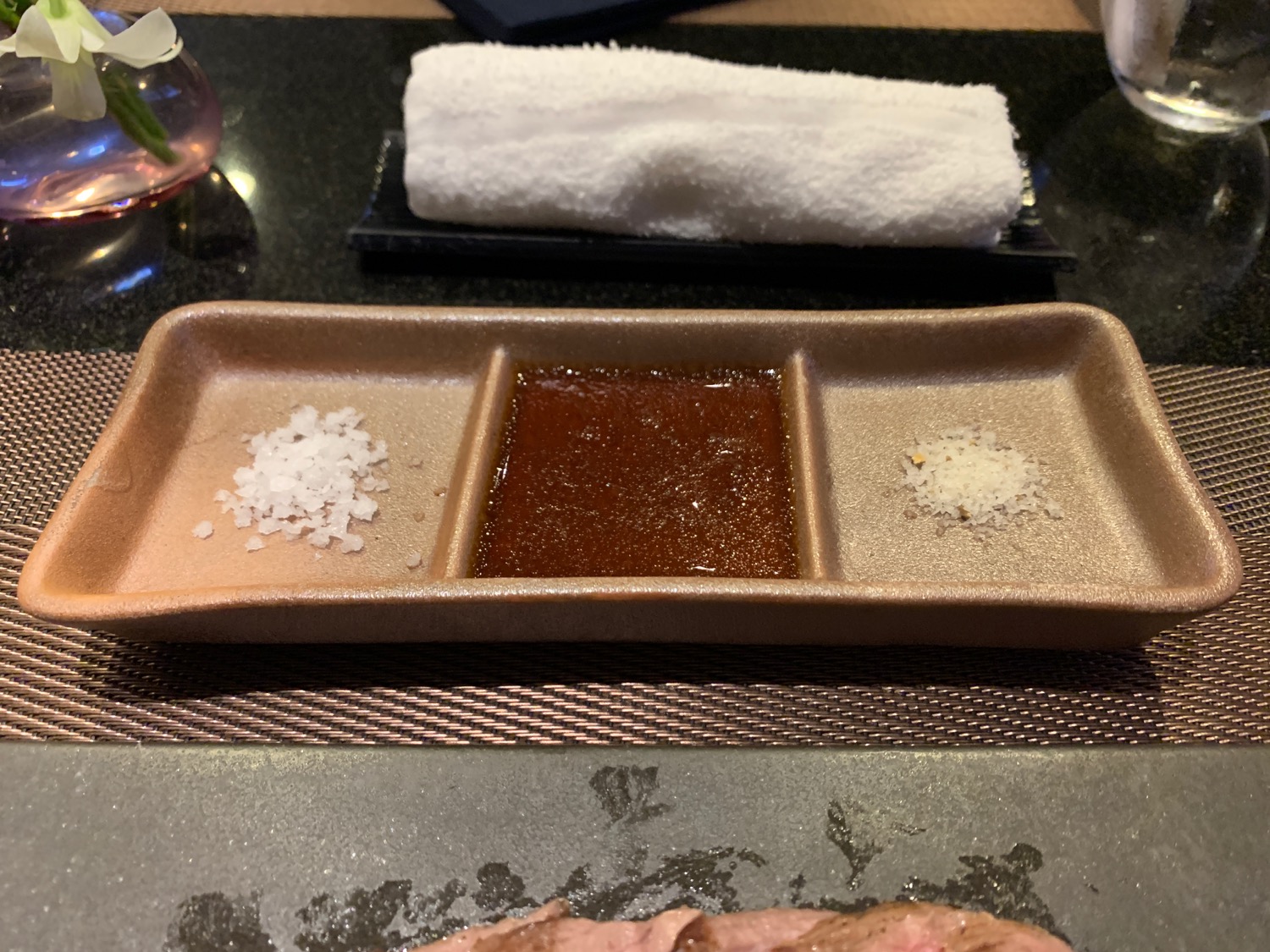 a plate with sauce and salt on it
