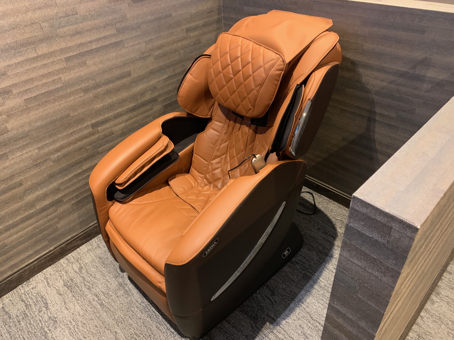 a brown massage chair in a room