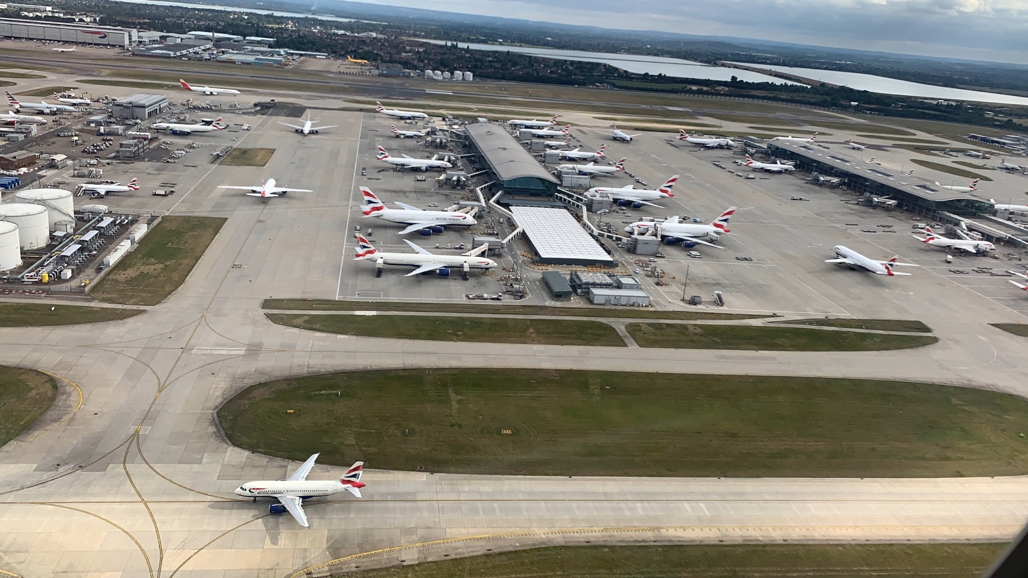 an aerial view of airplanes at an airport