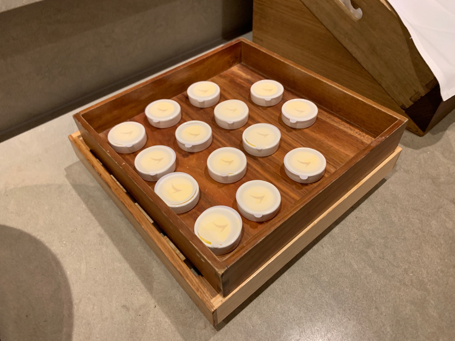 a wooden box with white circles on it