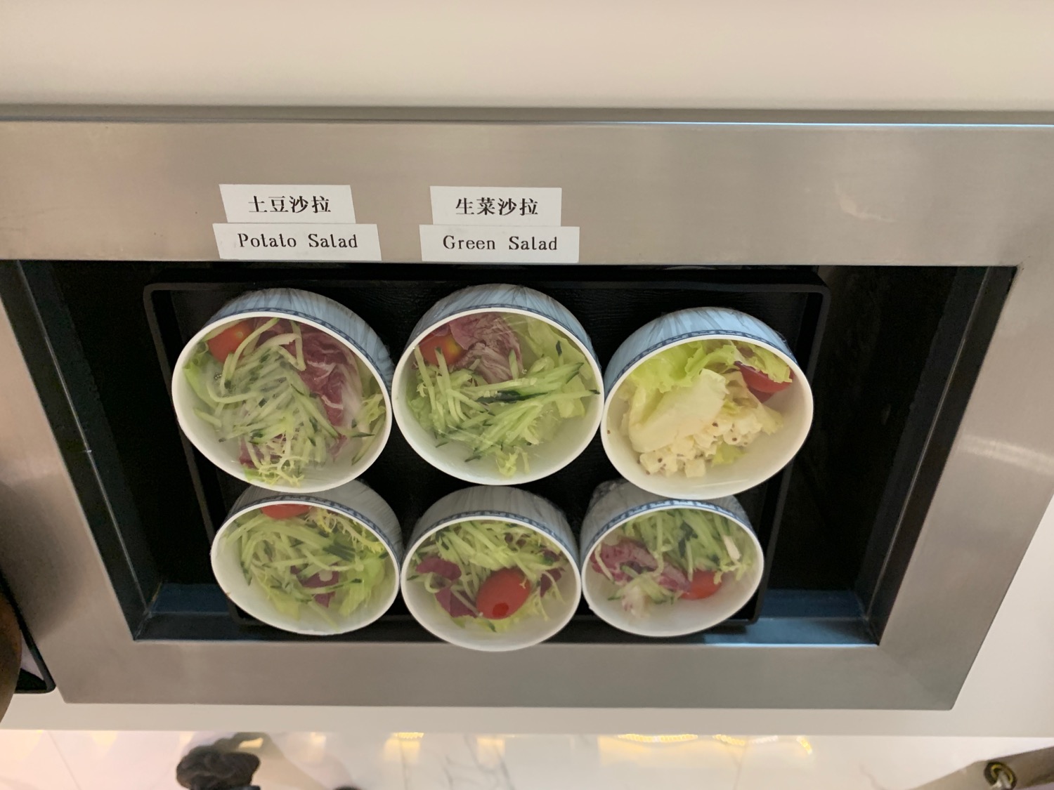 a salad in cups on a wall