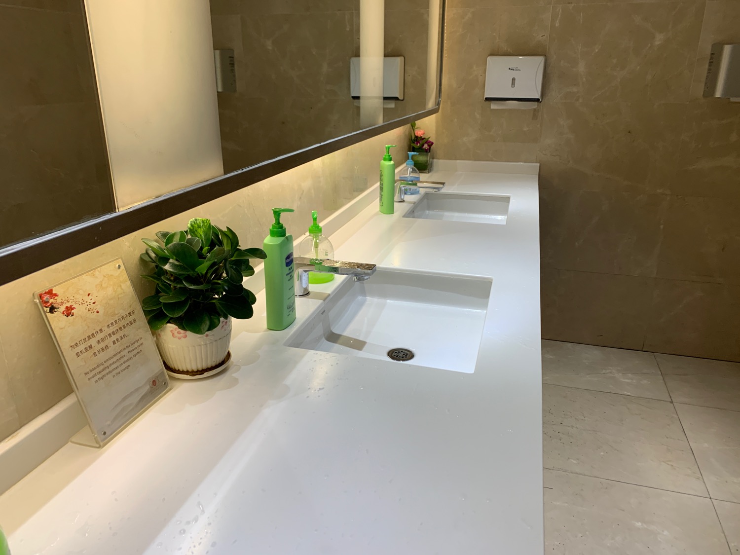 a bathroom with a mirror and sink
