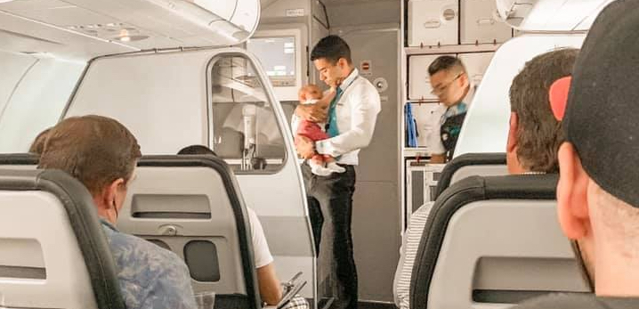 Flight Attendant Calms Baby