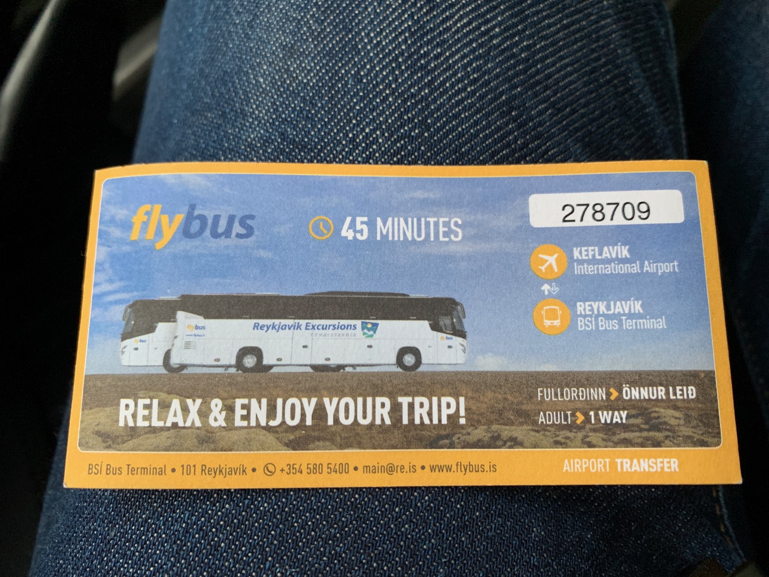 a bus ticket on a person's leg