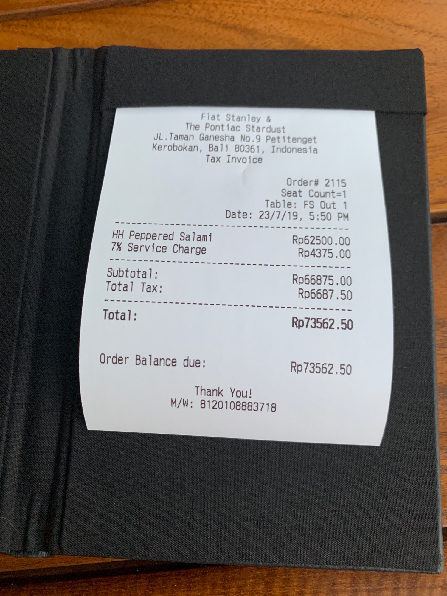 a receipt on a black cover