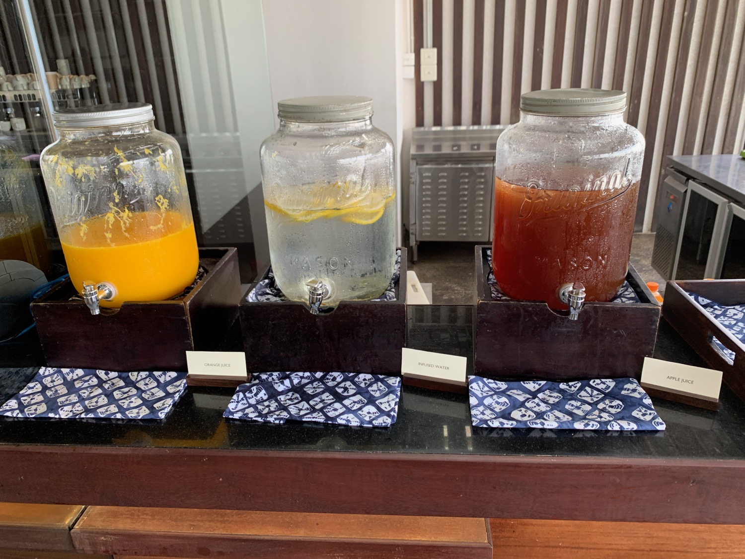 a group of glass jars with liquid in them