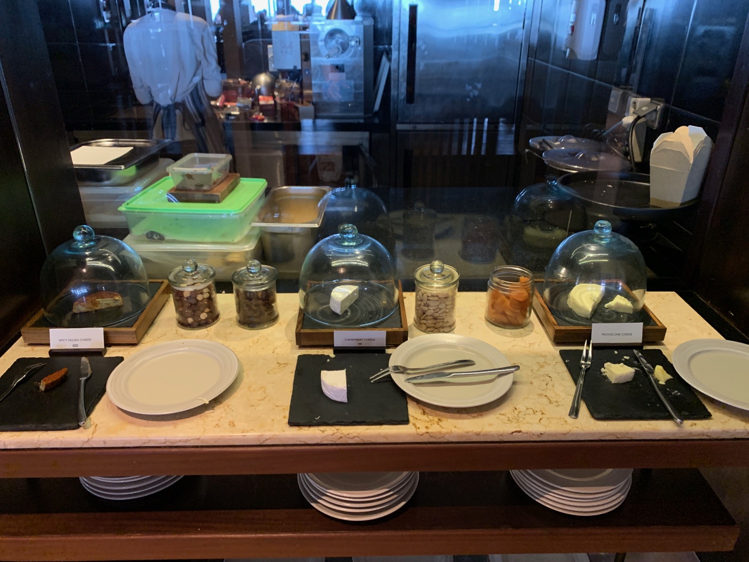 a table with plates and glass containers