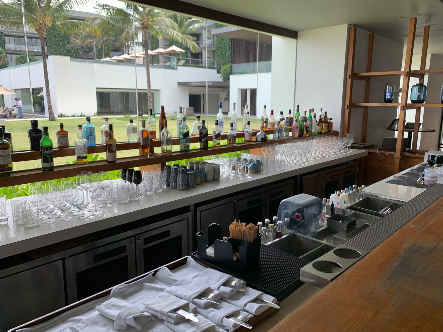 a bar with bottles and glasses