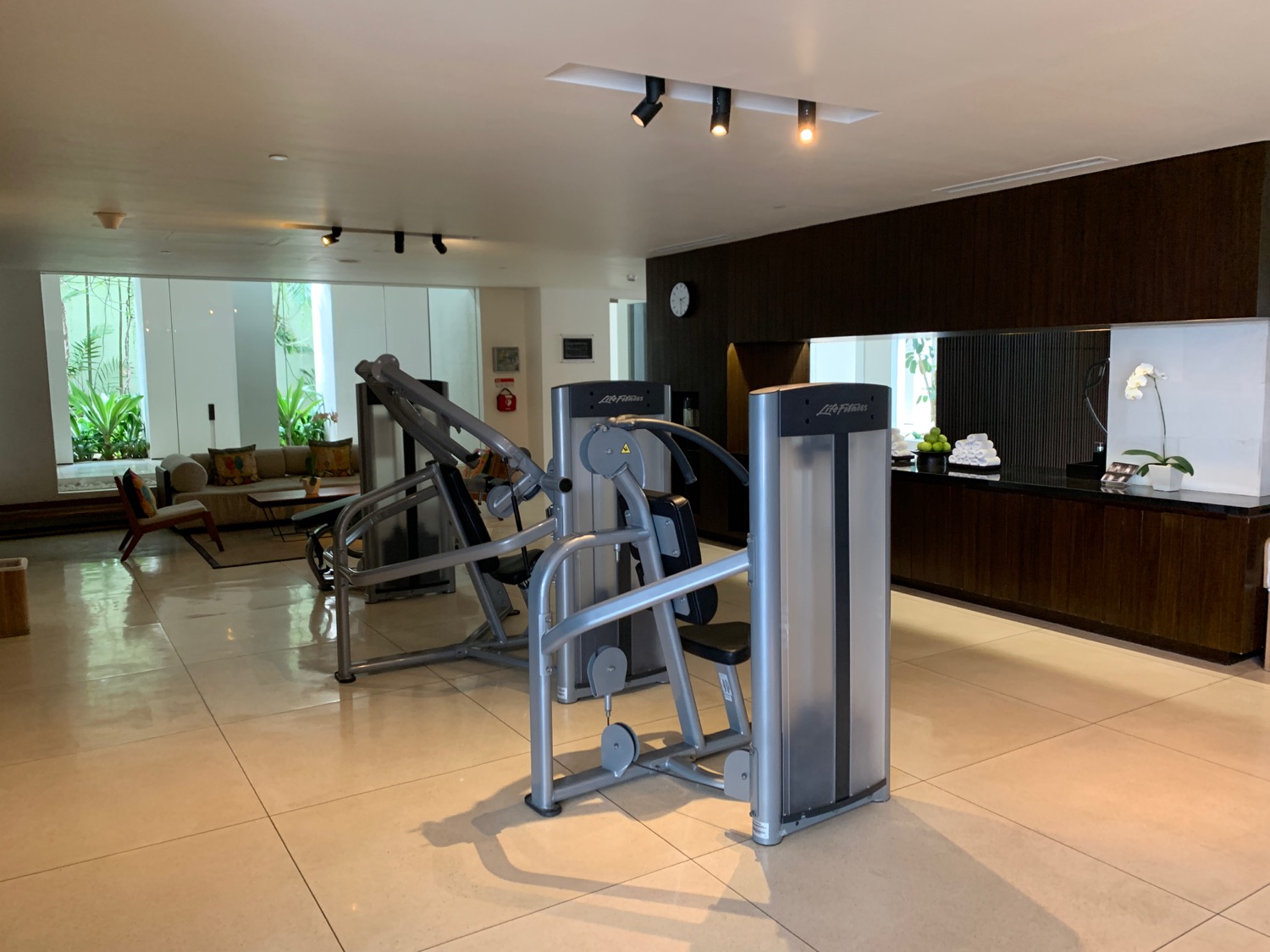 a gym with exercise equipment in a room
