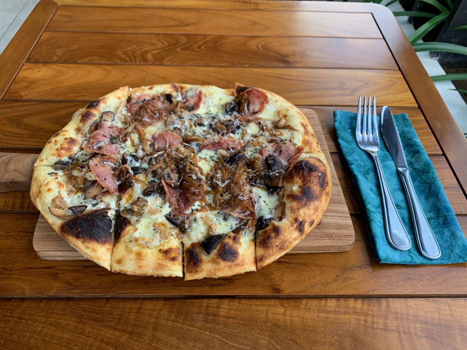 a pizza on a wood board