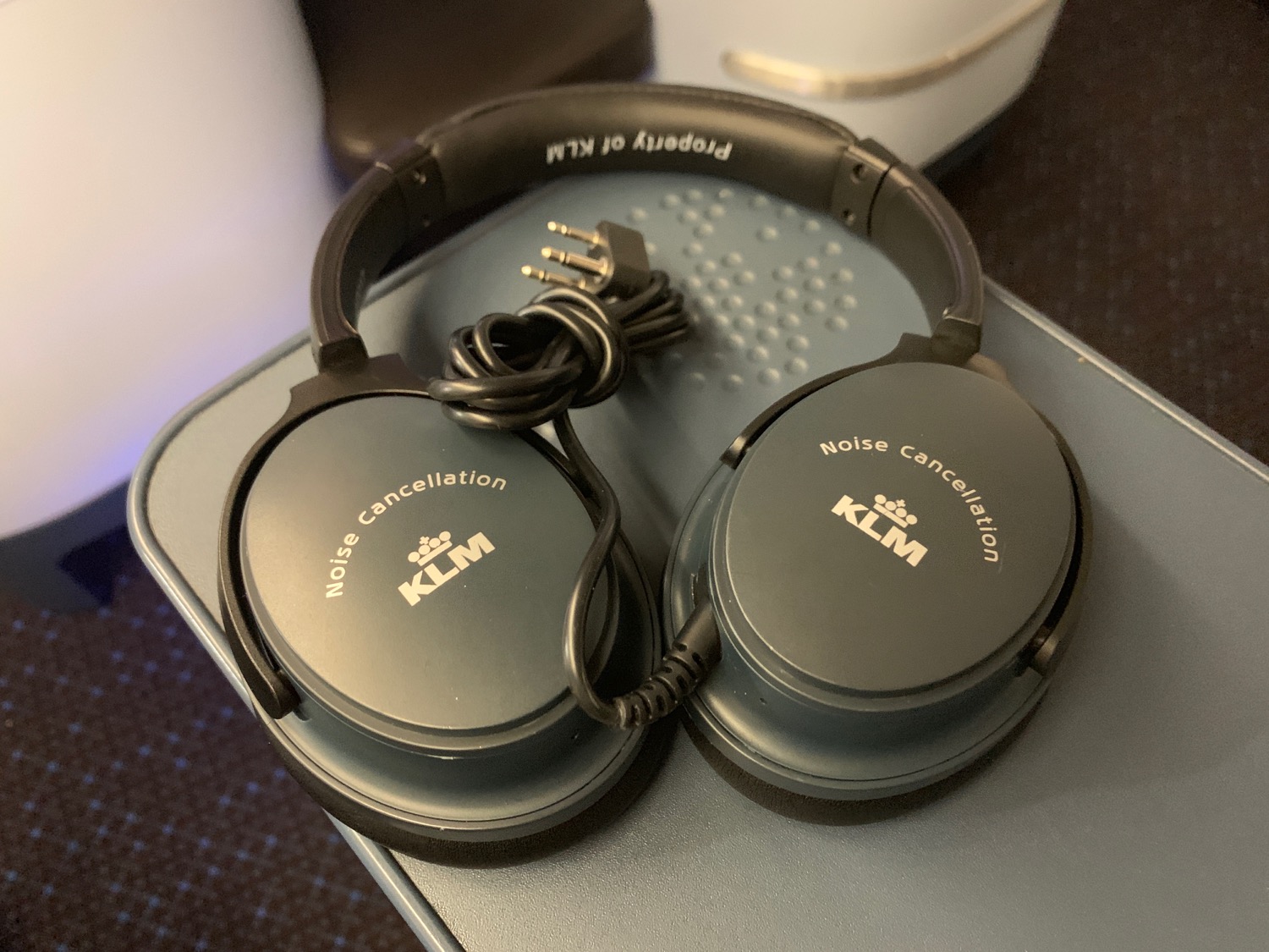 a pair of headphones on a grey surface