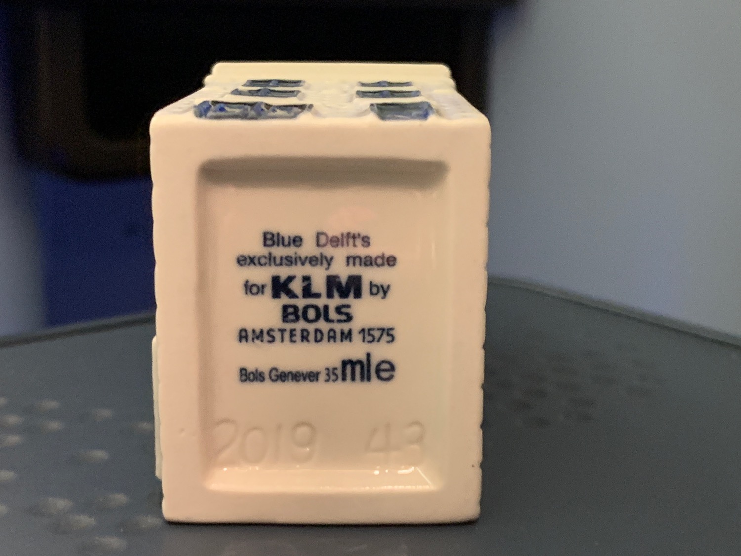 a white rectangular object with blue text on it