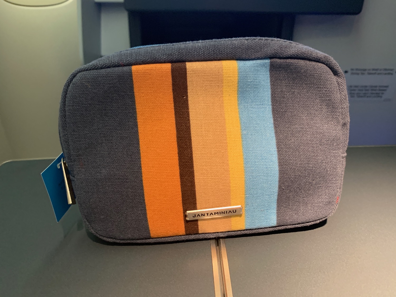 a small striped bag on a table