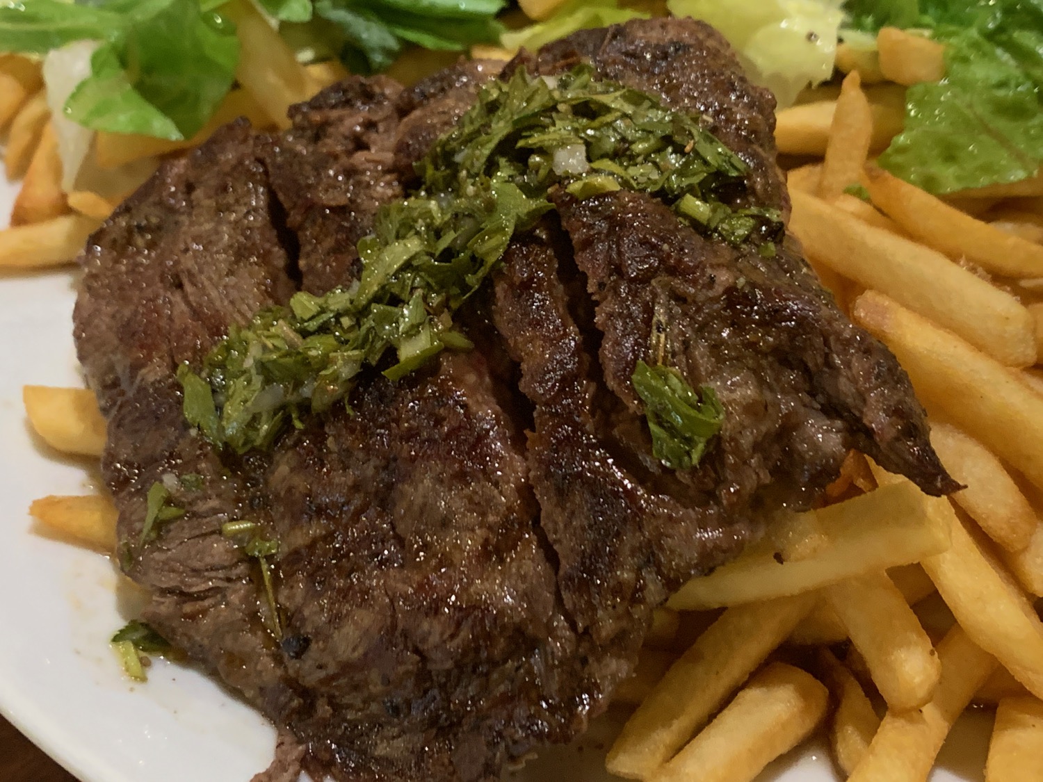 a plate of steak and fries