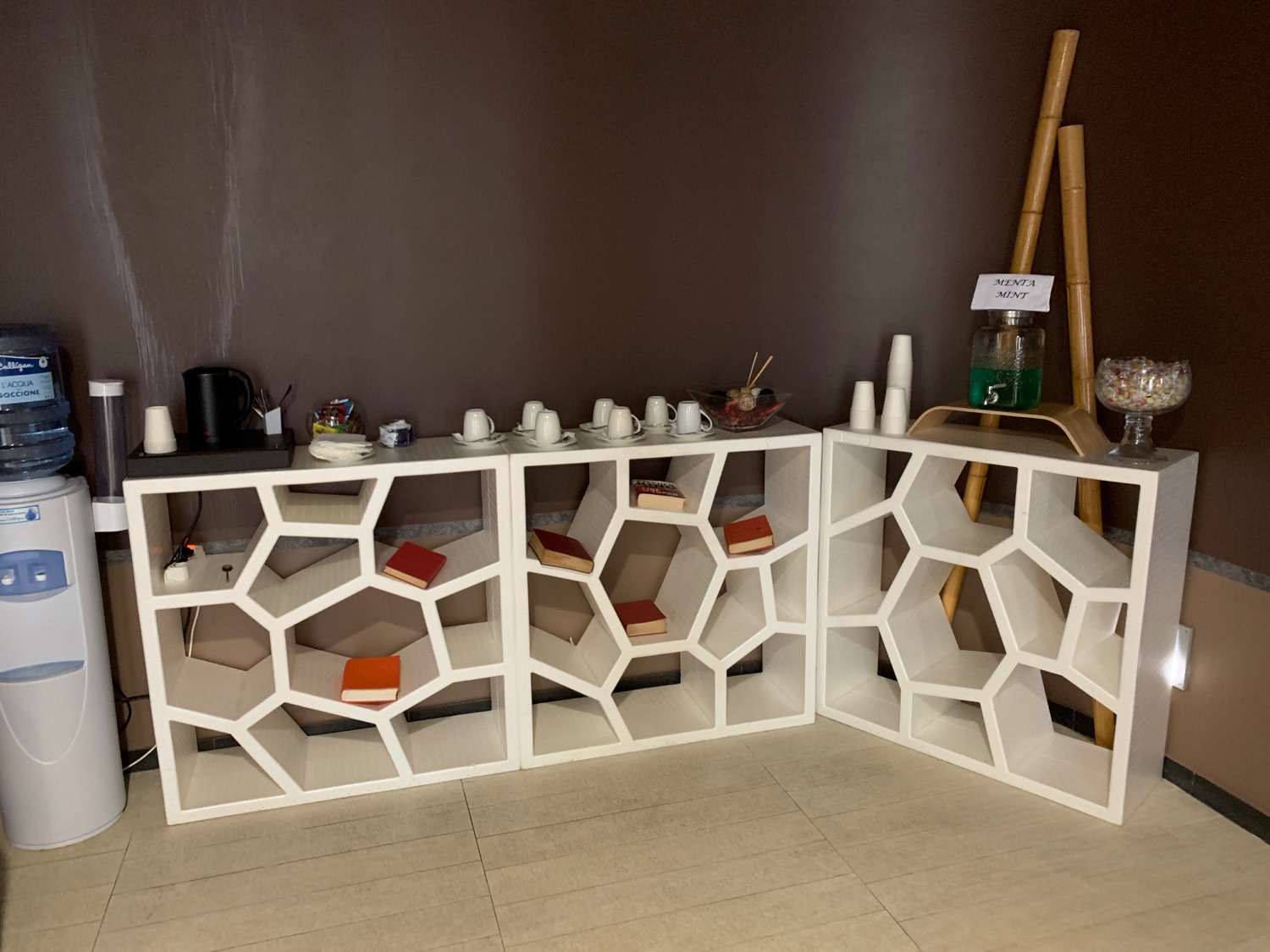 a white shelves with a pattern on them