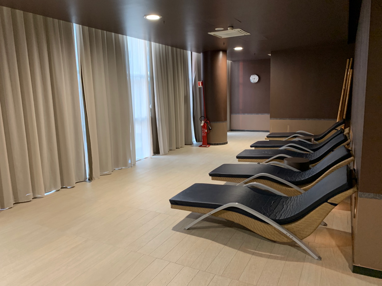 a row of lounge chairs in a room