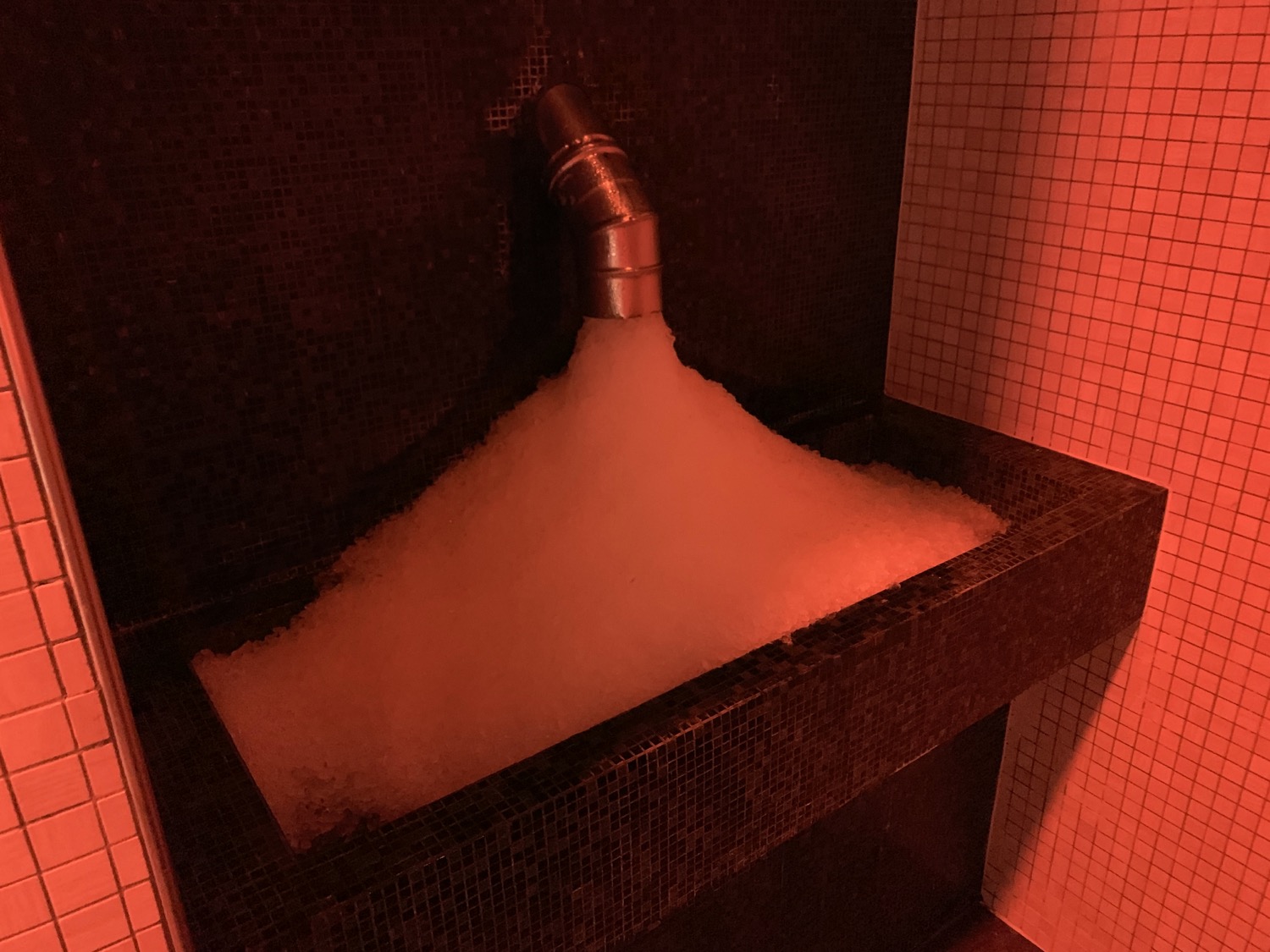 a bubble bath with a pipe coming out of it