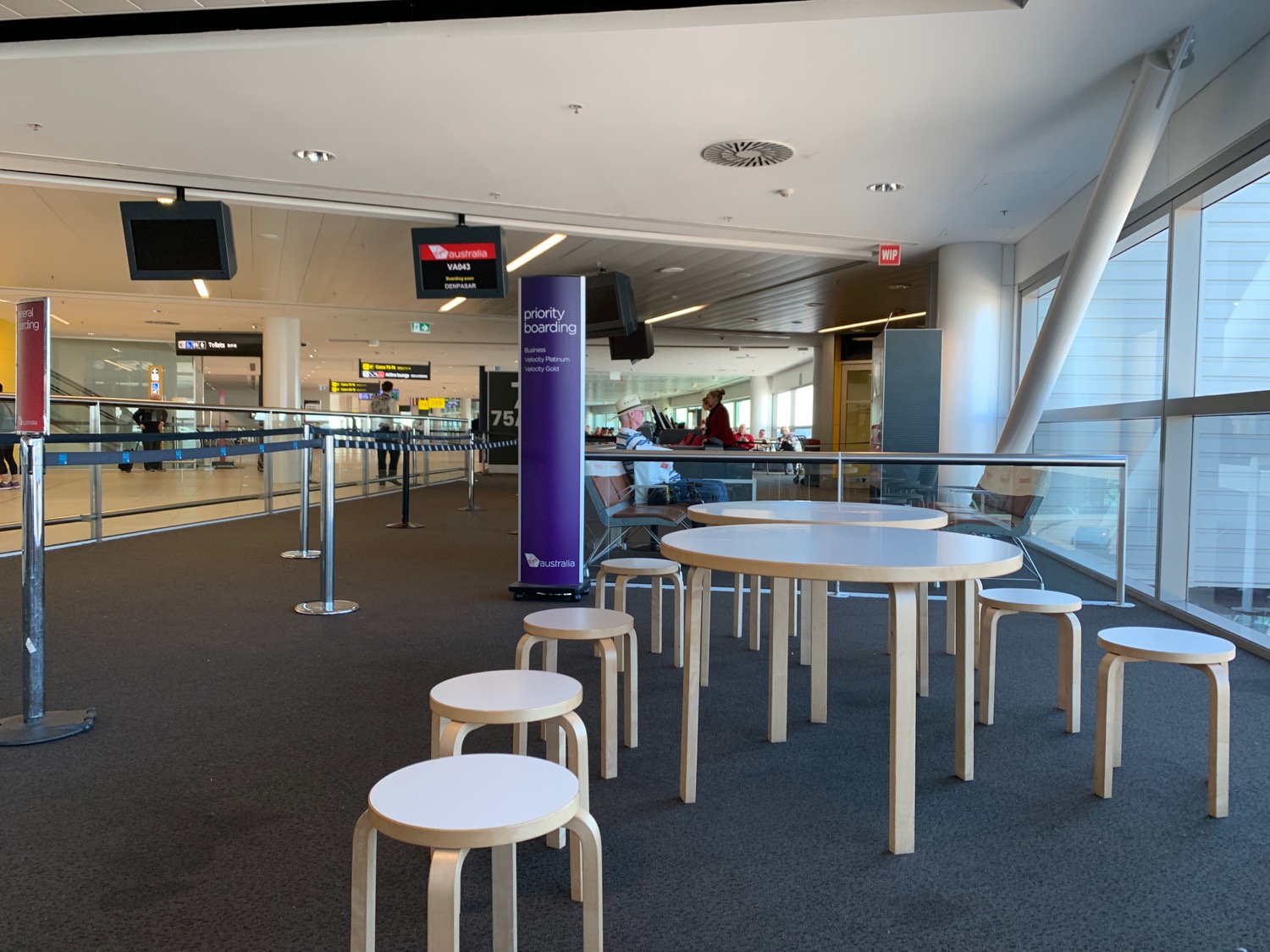 a group of tables and chairs in a terminal
