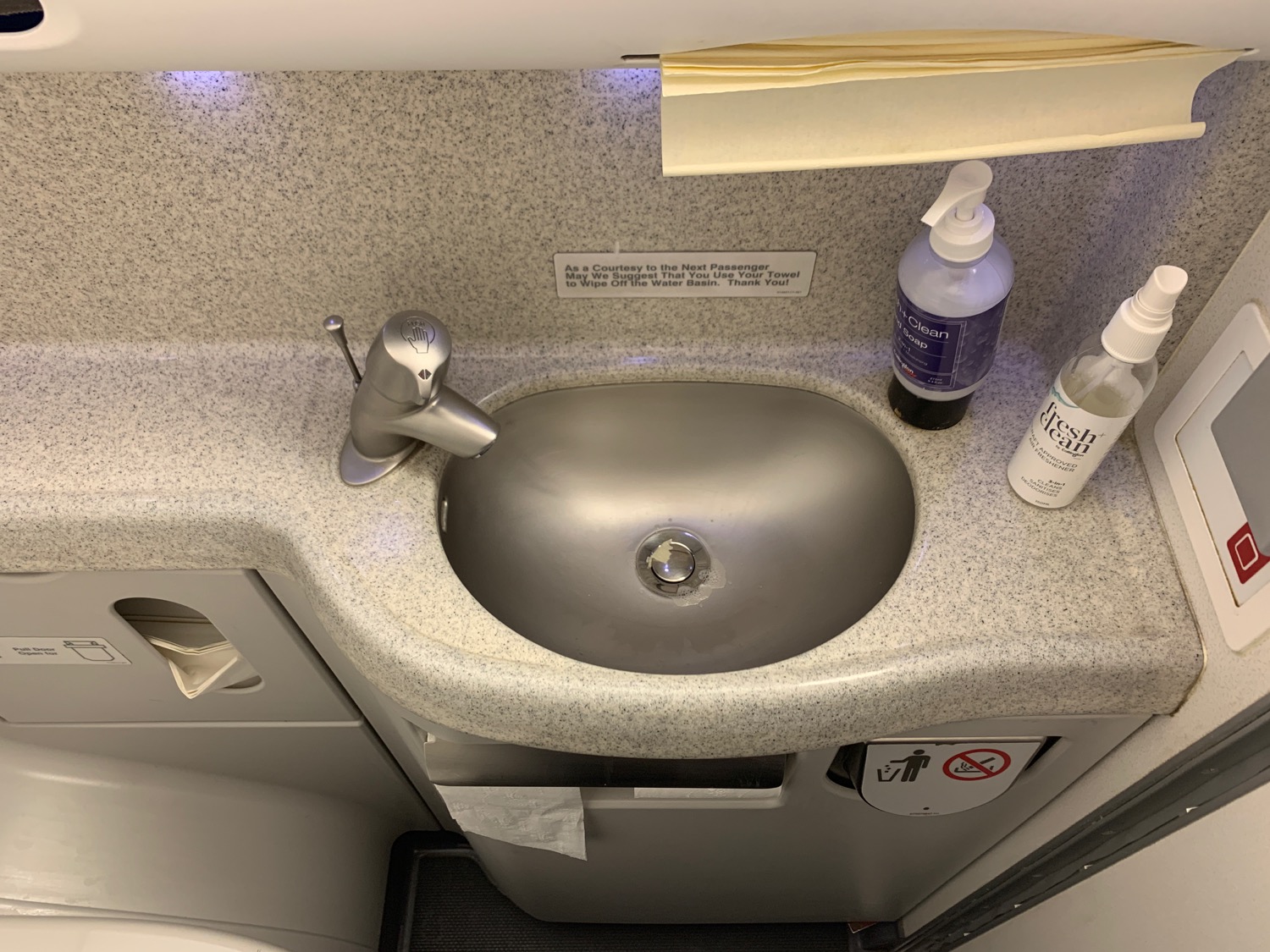 a sink and soap bottles on a counter