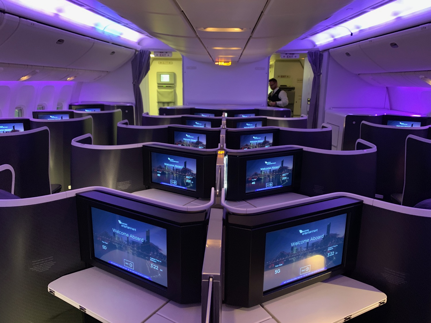 a row of televisions in an airplane