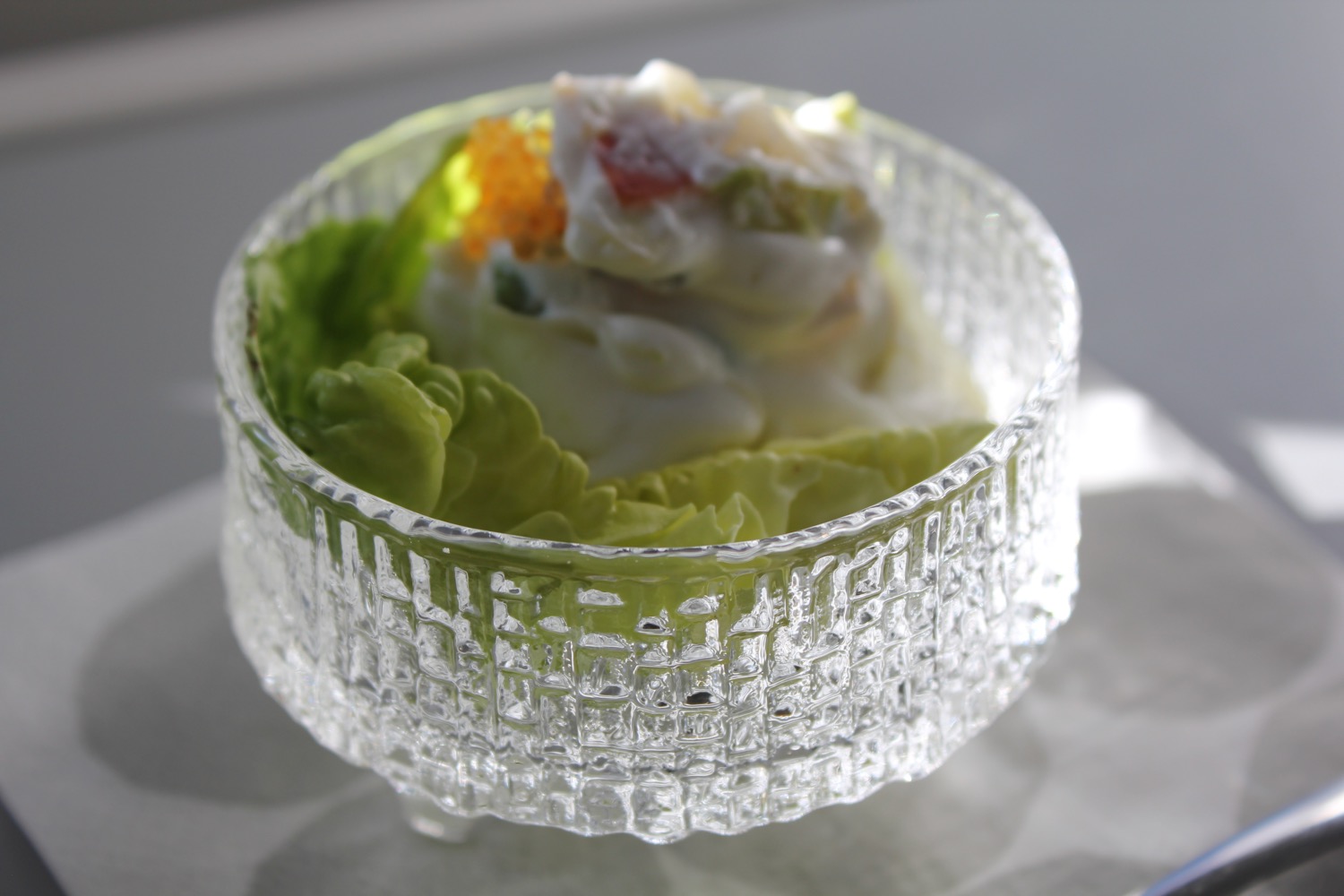 a glass bowl with food in it