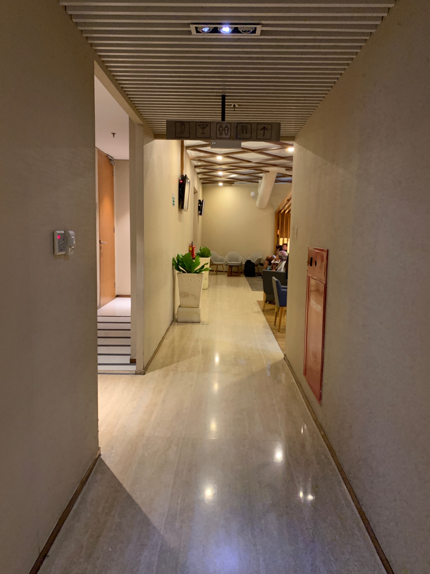 a hallway with a light shining on the walls