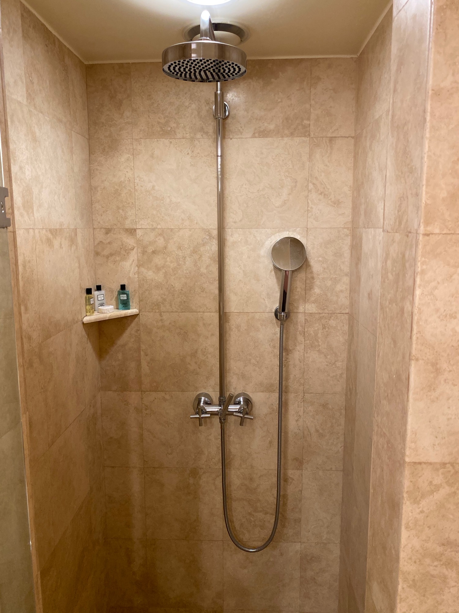 a shower with a round shower head