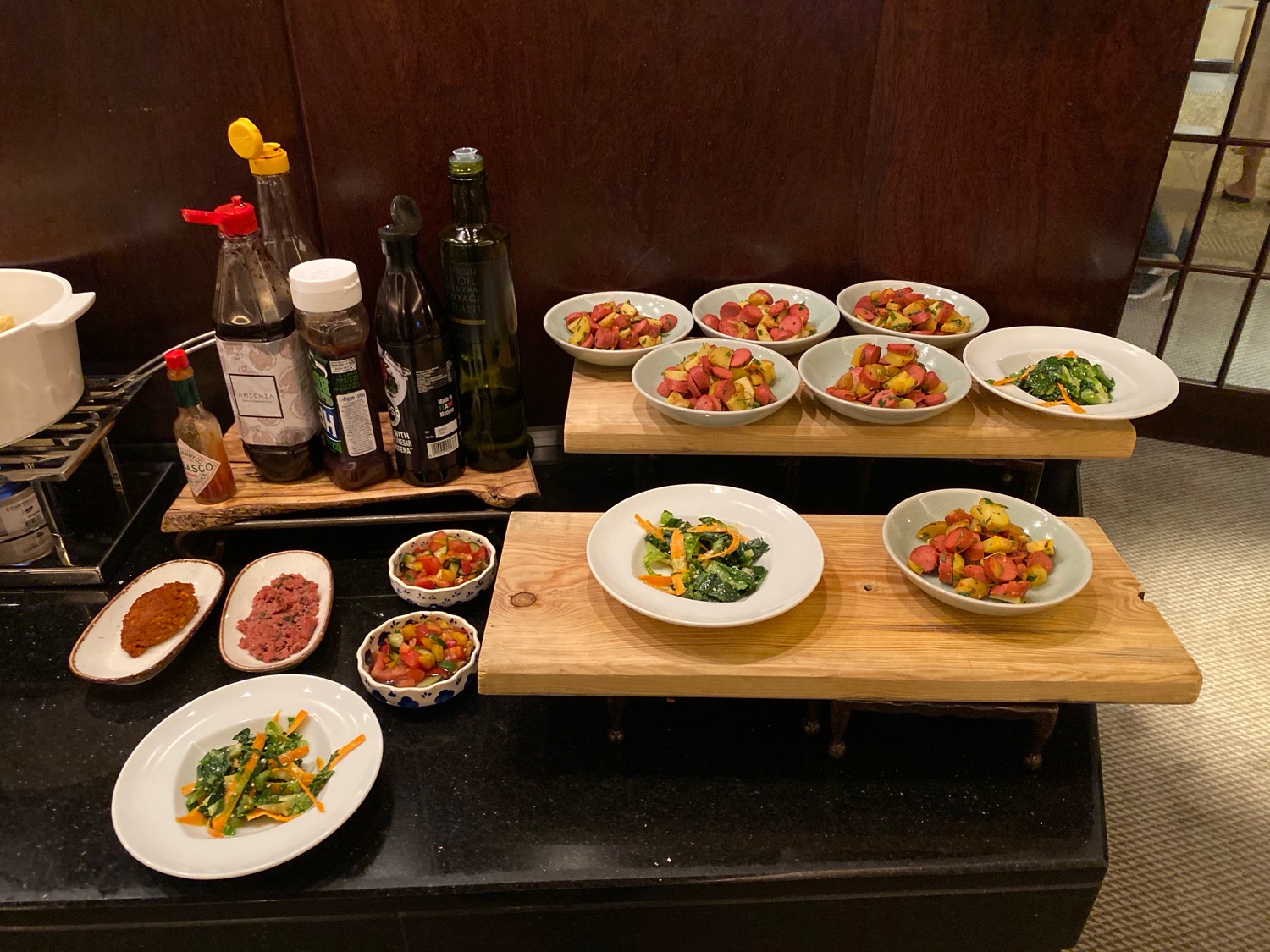 a table with plates of food and bottles