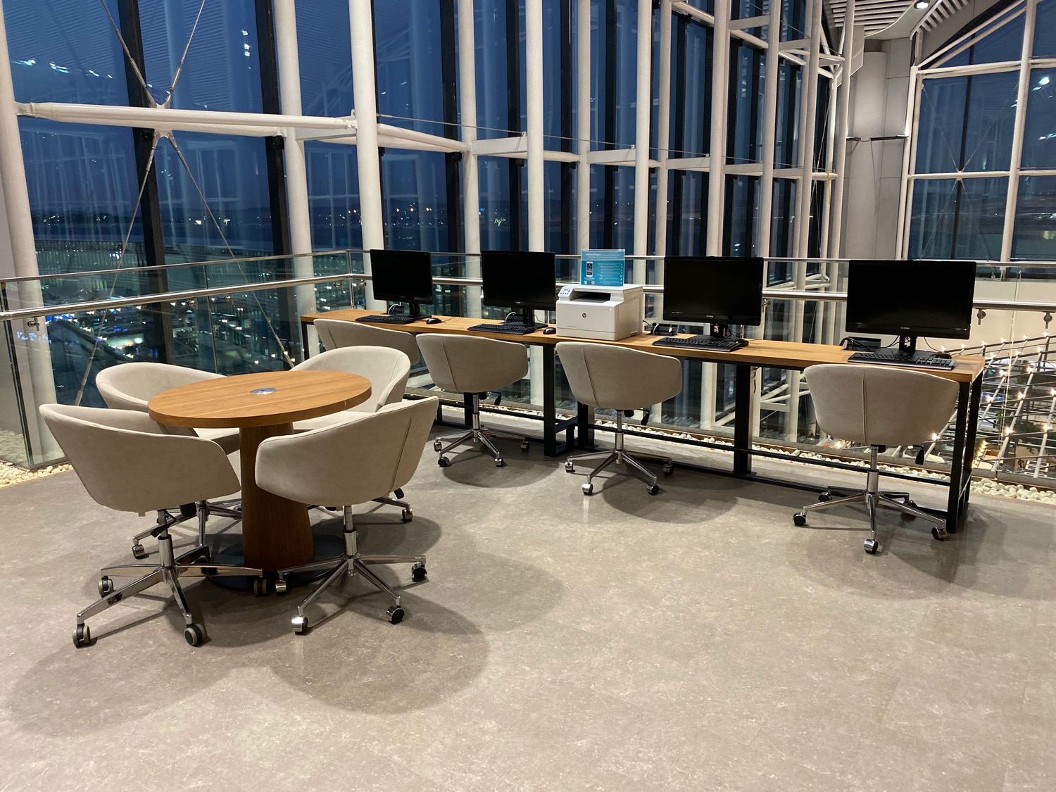 a room with computers and chairs