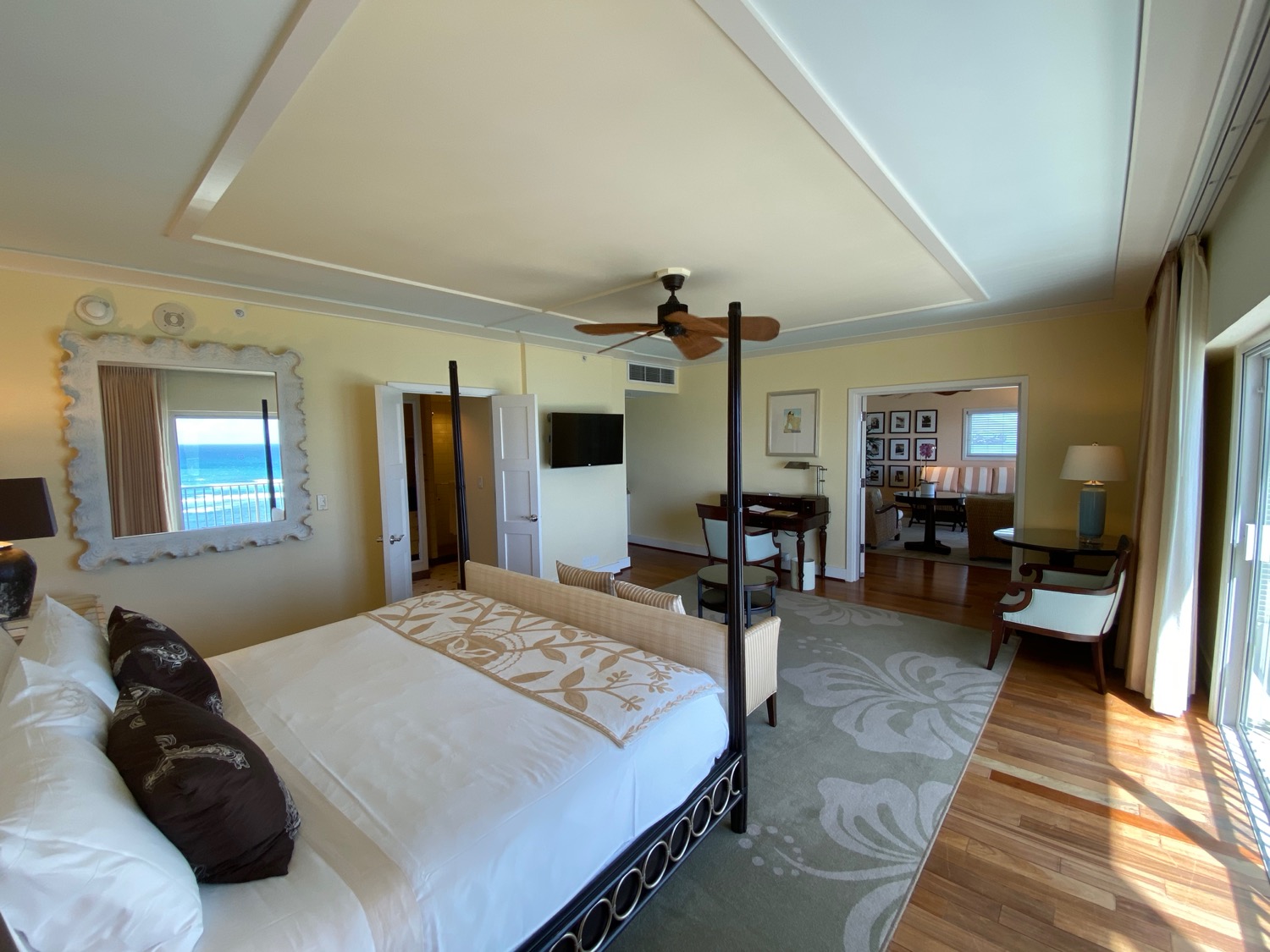 a room with a bed and a ceiling fan
