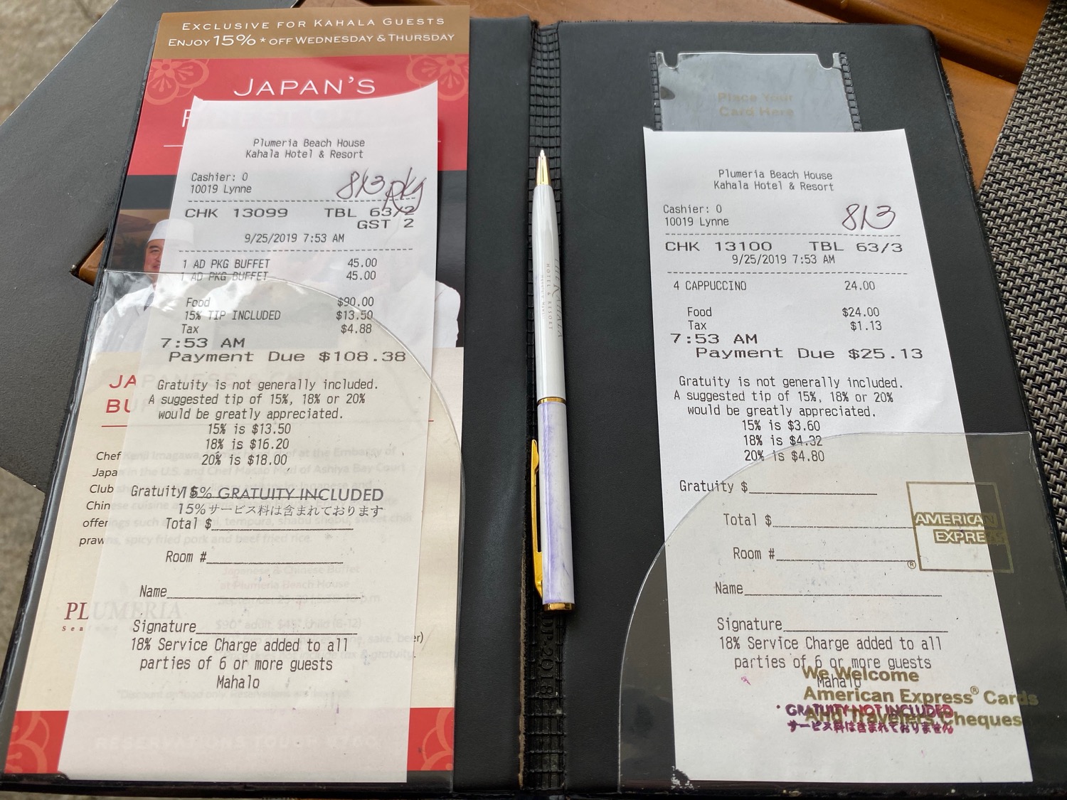 a pen and receipt in a restaurant