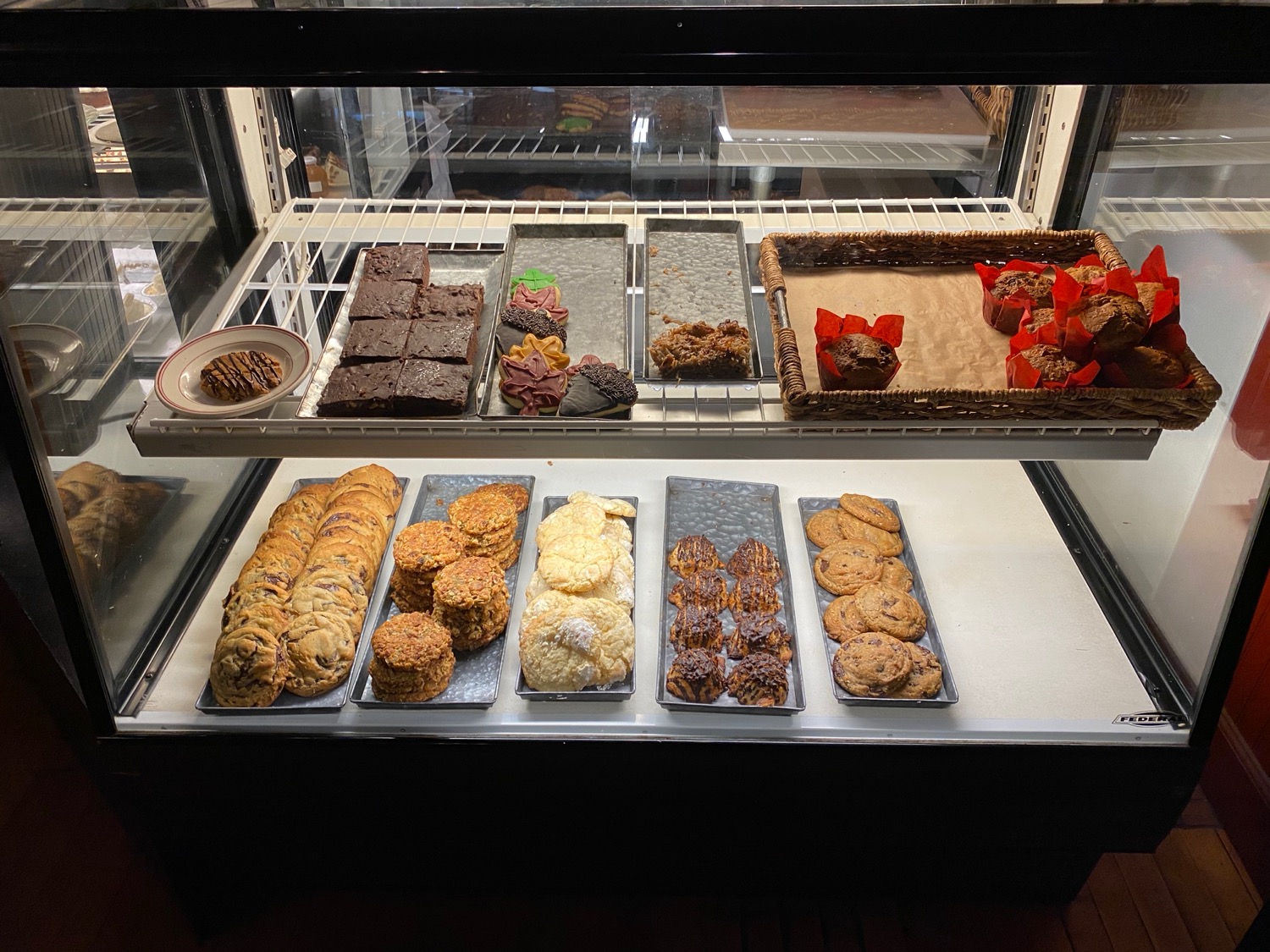 a display case with cookies and cookies