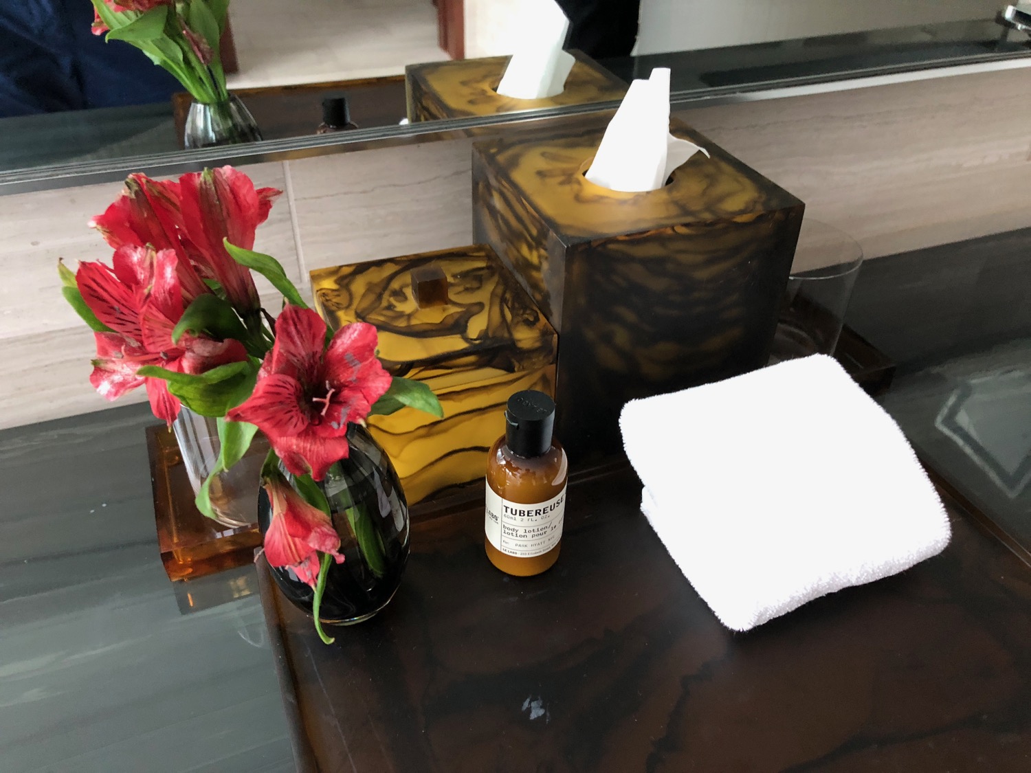 a tissue box and a vase of flowers