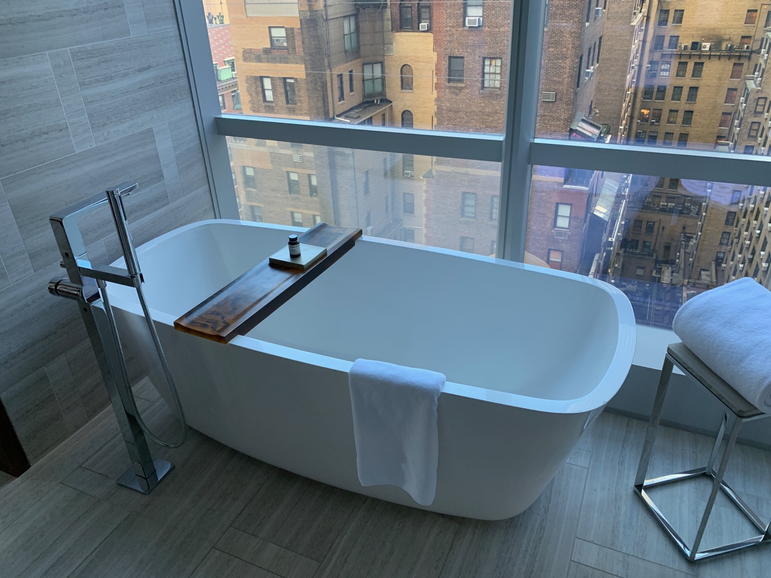 a bathtub in a bathroom with a window