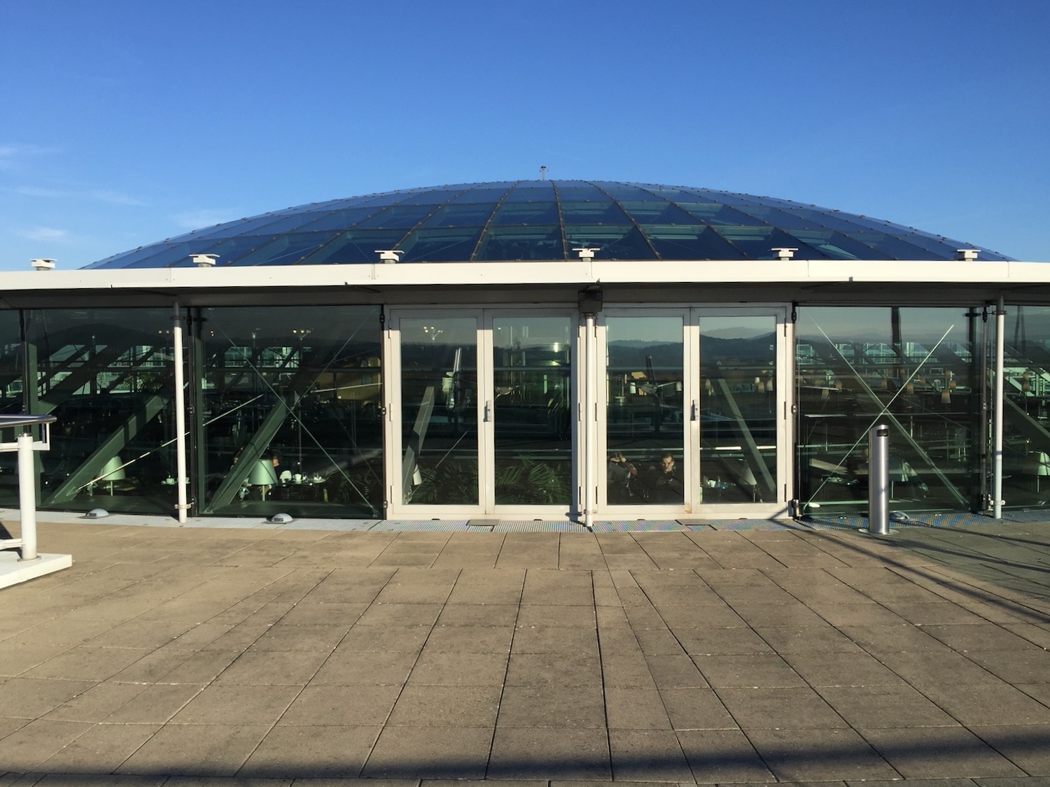 a glass building with a roof