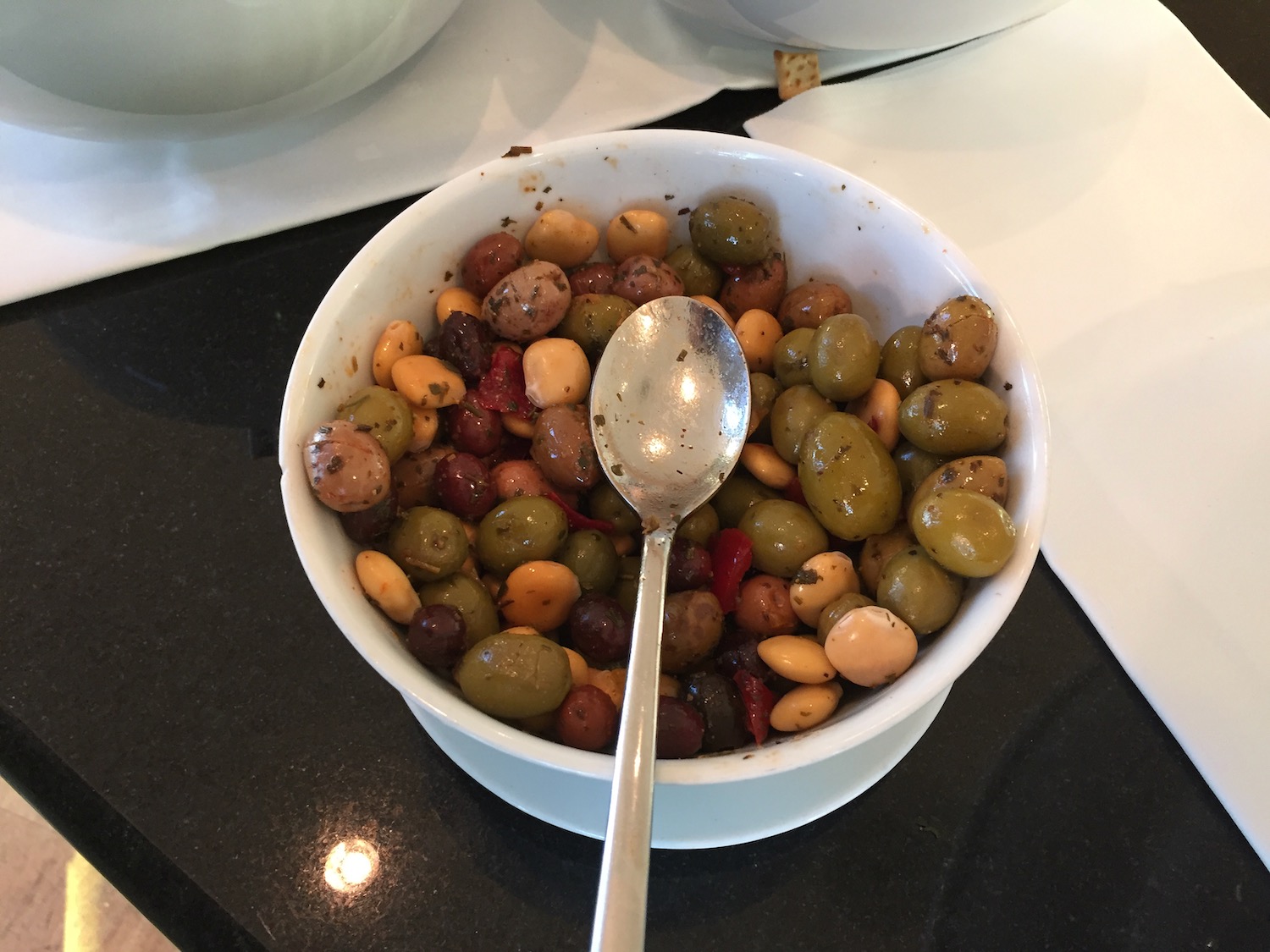 a bowl of beans and beans with a spoon