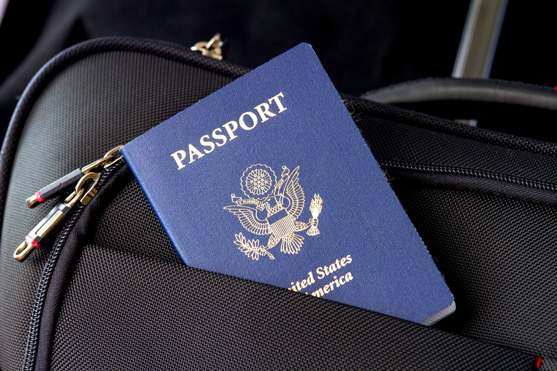 a passport in a black bag