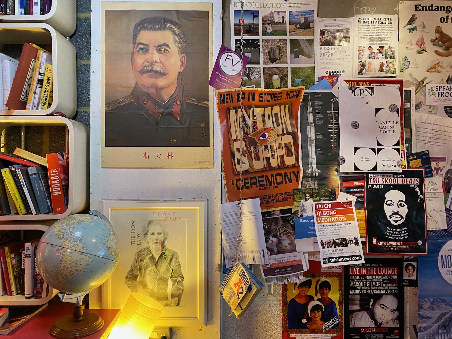 a wall with posters and pictures