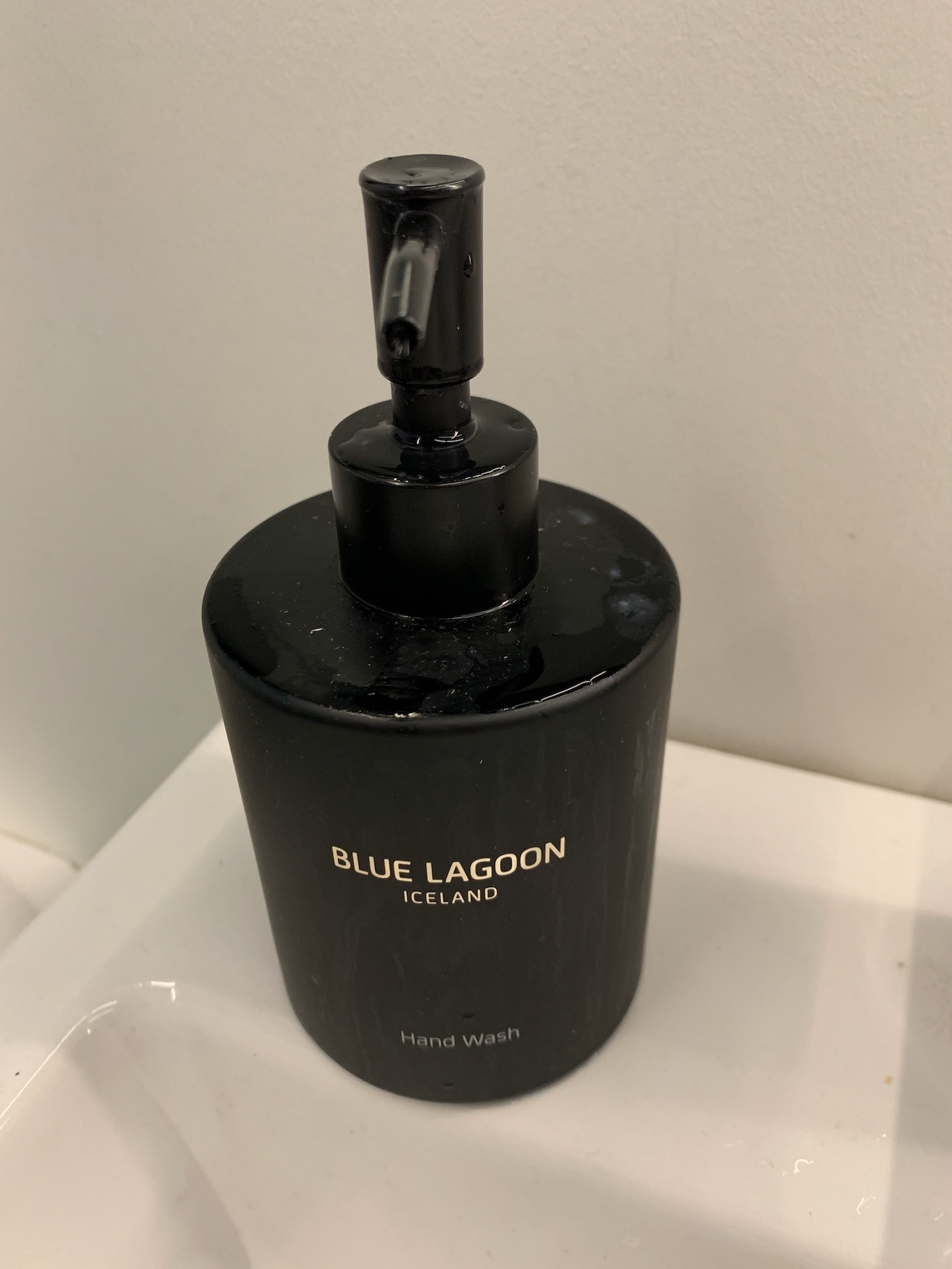 a black bottle of soap