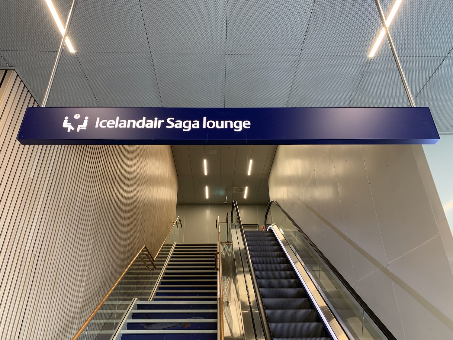 a escalator and a sign