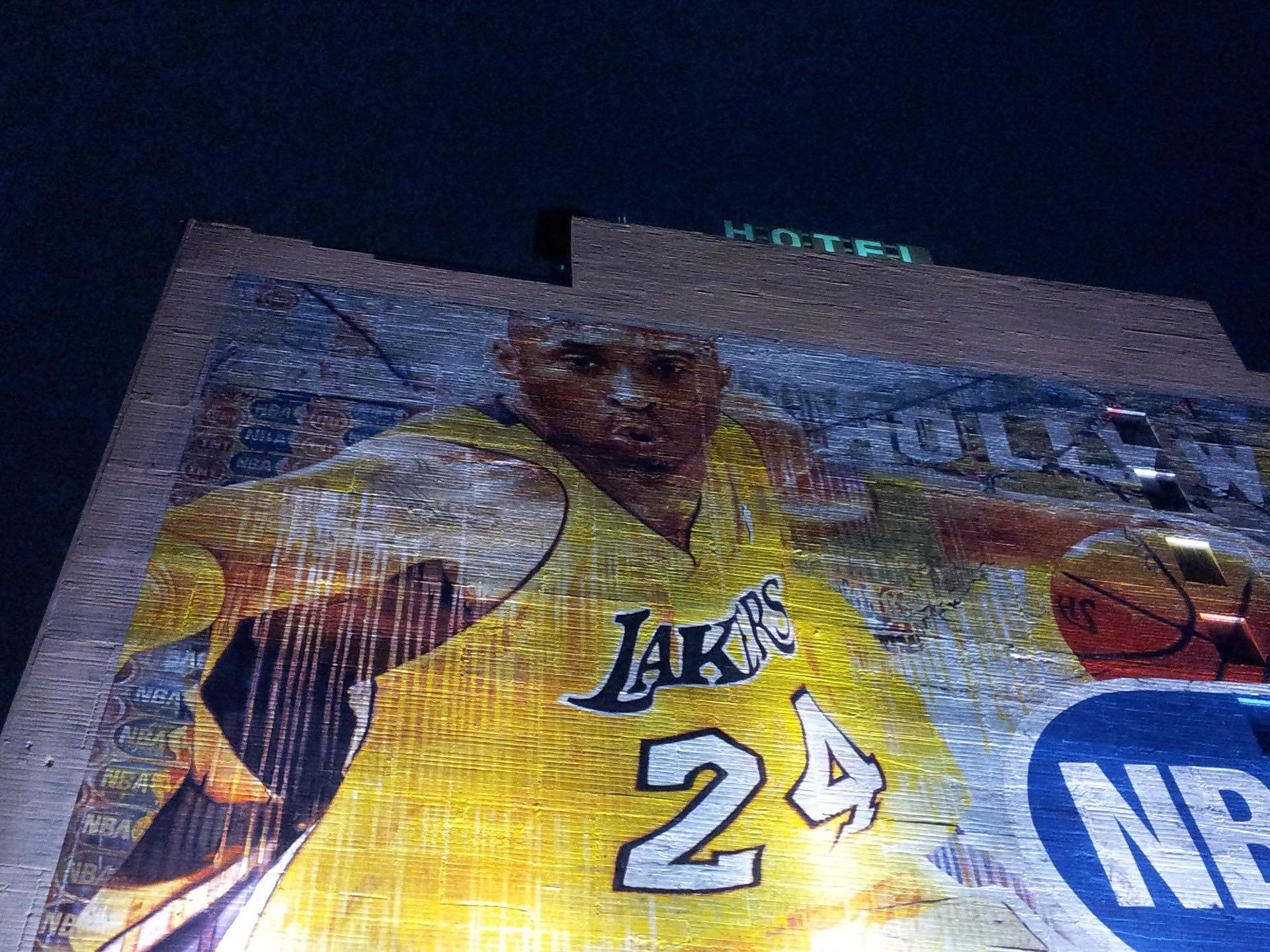 a large mural of a basketball player on a building